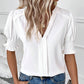 Elegant bluse med V-hals og pufærmer til kvinder