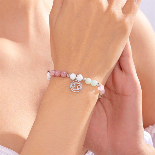 Armband med 12 stjärntecken och pärlor och berlock med astrologiska tecken