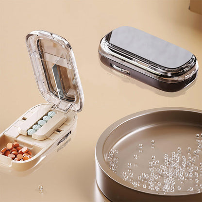 Bærbar pilleæske med udstikker